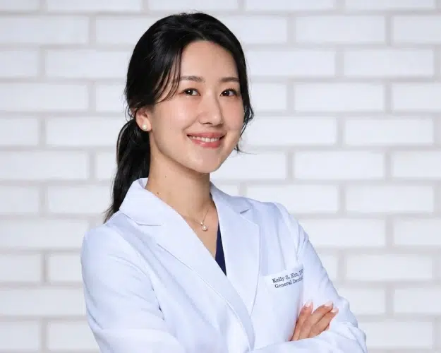 Dr. Kelly Kim providing compassionate dental care at Addison Dental Group